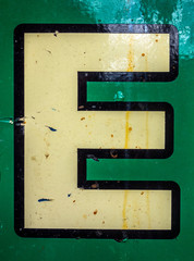  Written Wording in Distressed State Typography Found Letter E