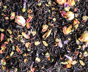Black tea leaves background