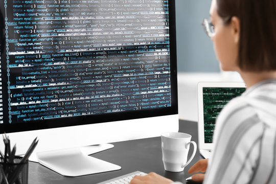 Female programmer working in office