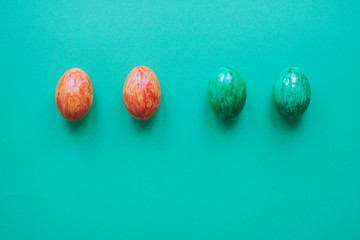 Easter eggs on green background.
