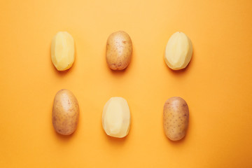 Composition with raw potato on color background