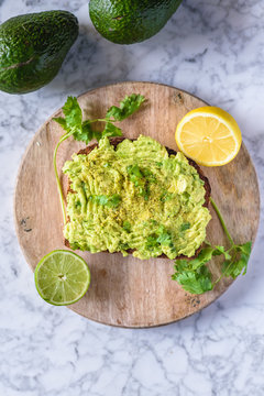 Fresh Vegan Avocado Toast with lemon and lime