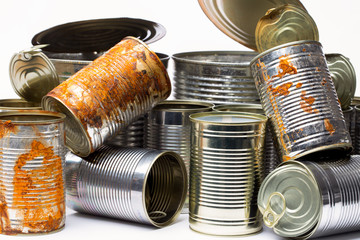 empty tin cans on white background