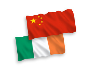 Obraz premium National vector fabric wave flags of Ireland and China isolated on white background 1 to 2 proportion.