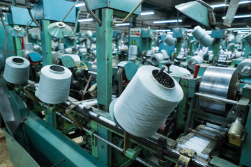 old knitted fabric. Textile factory in spinning production line and a rotating machinery and equipment production company
