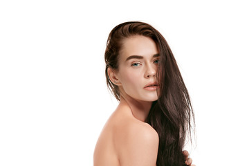 Fototapeta premium A beautiful female face. Perfect and clean skin of young caucasian woman on white studio background.
