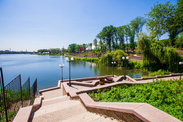 Stairs and parapet on the shore of the pond