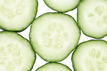 Slice of cucumber isolated on white background, top view