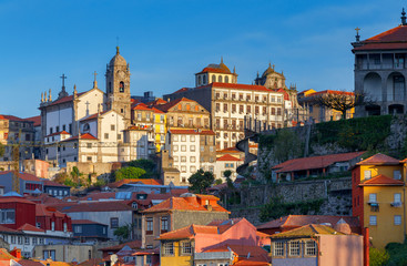 Naklejka na ściany i meble Porto. Multicolored houses on the waterfront of the Douro River.