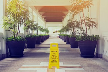 Sign showing warning of caution wet floor in the building