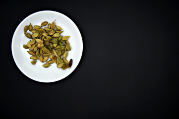 spices in a spoon on white background