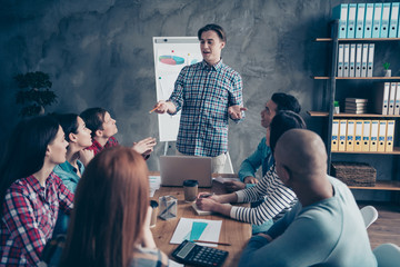 Company of attractive beautiful handsome experts specialists sharks wearing casual wear talking about new finance marketing plan at industrial interior workplace workstation
