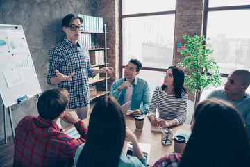 Company of nice stylish trendy attractive beautiful handsome specialists sharks wearing casual wear talking about new financial progress growth plan at industrial interior workplace workstation