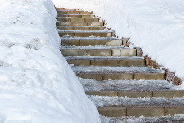 grey concrete stairs in the snow