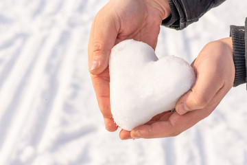 heart of snow in hands