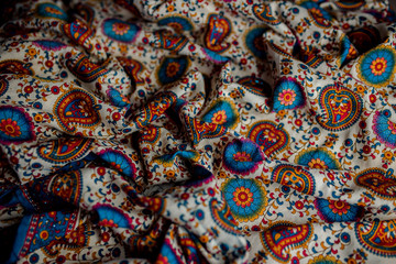Indian colorful fabric with red, blue and green colors.