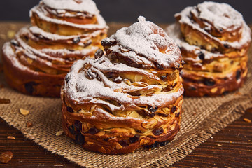 Tasty sweet buns with raisins and icing sugar. Homemade baking concept