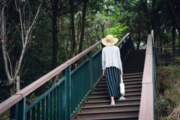 Fototapeta premium woman walking at the stairs in the outdoor
