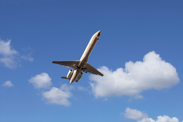Flying passenger airplane preparing to land