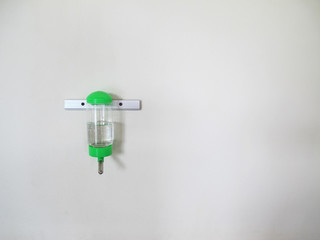 Water bottles for pet on the wall