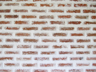 Red brick wall old vintage with peeling plaster background texture