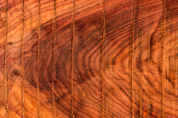 The abstract natural slab wood texture of the background. The creative concept of ecological nature. Background mahogany pattern.