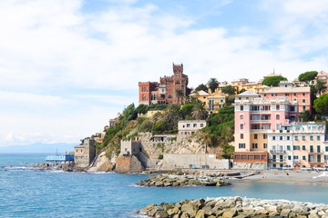Fototapeta na wymiar Genova, Italy. Beautiful view of Vernazzola Beach, colorful houses village in Genoa, Italy