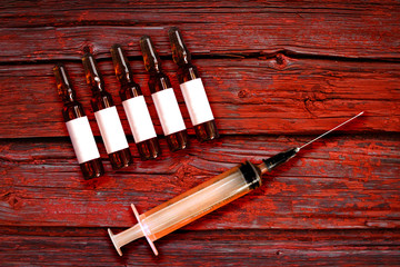 Euthanasia or mercy killing. Malpractice medicine. Syringe with needle and ampules set for assisted...
