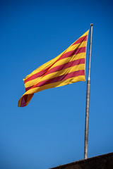 Senyera - Flag of Catalonia waving in the wind