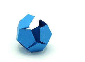 Geometric shape cut out of Blue paper and photographed on white background.Dodecahedron. 2d shape...