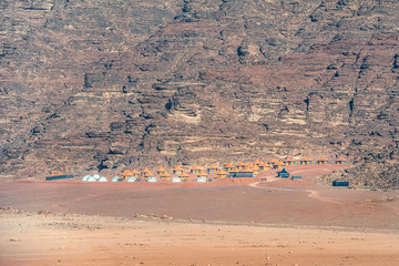 bedouin camp in incredible lunar landscape in Wadi Rum village in the Jordanian red sand desert....