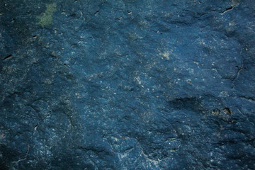 Background and black marble. Bedrock Stone In the forest near the waterfall