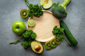 Healthy Foods. Organic and Fresh green vegetable for detox, diet and weight loss on the concrete background. Healthy Concept