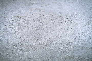 Concrete wall with stains and cracks