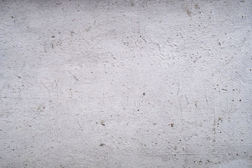 Concrete wall with stains and cracks
