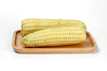 Corn on wooden plate, Waxy Corn, isolate on white background
