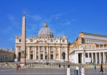 Fototapeta na wymiar VATICAN CITY, VATICAN, Italy - March 2019: Fragments of the Papal Basilica of St. Peter (San Pietro Piazza) in the Vatican and columns on Saint Peter`s square in Rome