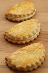Freshly baked sochni. Wooden background, high resolution