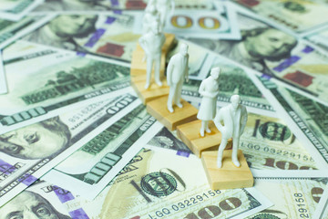  figure human and  100 dollar banknote  business content.