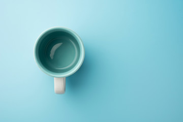 Empty glass cup milk or coffee isolated on blue background  food drink object design