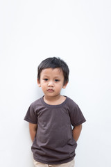 Portrait of a toddler boy wearing grey T-shirt on white background