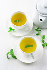 cup of herbal tea, white background