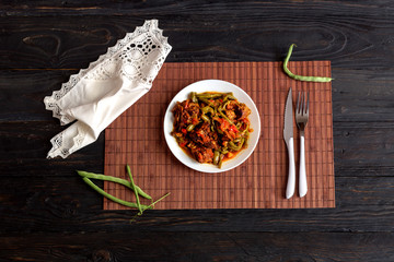 The stewed green beans and pieces of beef