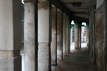 Gallery with columns in the street Venice Italy