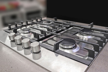 New modern gas stove with four burners for the kitchen, stainless steel surface, cast iron grates