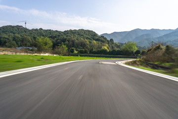 empty asphalt road with city skyline