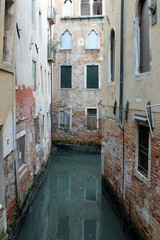 Narrow water channel in Venice Italy