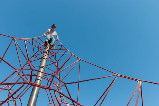Boy climbing ropes