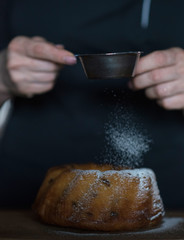 Fototapeta na wymiar preparation of cake with powdered sugar