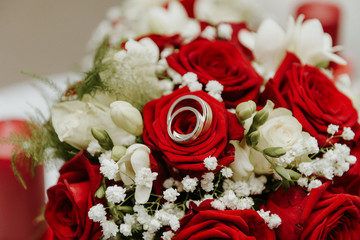 wedding rings in a bouquet of roses